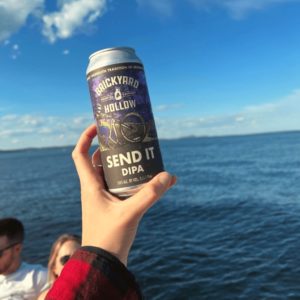 Brickyard Hollow craft beer can on the water
